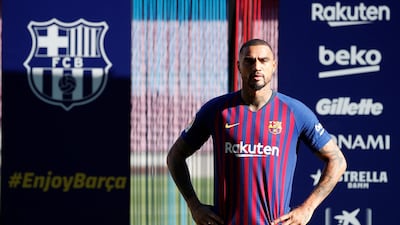 Kevin-Prince Boateng poses for photographs during the presentation. Reuters