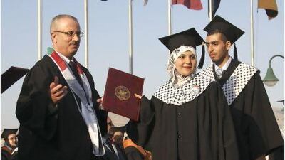 Rami Hamdallah, left, is the Palestinian Authority's new prime minister. Nasser Ishtayeh / AP Photo