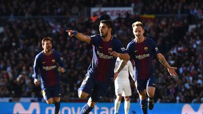 MADRID, SPAIN - DECEMBER 23: Luis Suarez of Barcelona celebrates after scoring his sides first goal during the La Liga match between Real Madrid and Barcelona at Estadio Santiago Bernabeu on December 23, 2017 in Madrid, Spain. (Photo by Denis Doyle/Getty Images)
