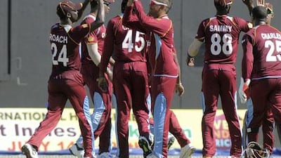 Sunil Narine, centre, took four Pakistan wickets to win the man-of-the-match award. Randy Brooks / AFP
