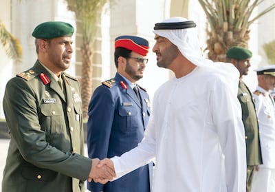Sheikh Mohamed bin Zayed, Crown Prince of Abu Dhabi and Deputy Supreme Commander of the UAE Armed Forces, greets a member of the UAE Armed Forces, during the inauguration of the Presidential Guard Martyrs Park, at Mahawi Military Camp. Rashed Al Mansoori / Ministry of Presidential Affairs