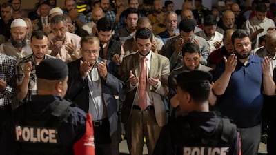 Jordan Security forces cordon protesters as they pray during a demonstration next to the US Embassy in Amman. EPA