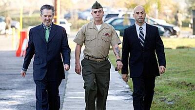 Marine Corps Staff Sgt Frank Wuterich, centre, pleaded guilty to negligent dereliction of duty for leading his troops to disregard rules of combat during the Iraq war.
