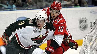 Hurricanes' Brandon Sutter, right, tries to stop Minnesota's Mikko Koivu during the game in Helsinki on October 8, 2010.
