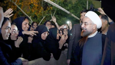 Iranian President Hassan Rouhani greeted by university students as he leaves Sistan University in Sistan and Baluchestan’s provincial capital of Zahedan on Tuesday, April 15, 2014. Maryam Rahmanian for The National