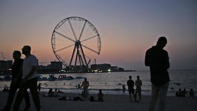 The sun sets behind Ain Dubai during construction in 2017. AP Photo