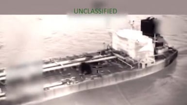 A screengrab from a video shows the US Coast Guard boarding and seizing the tanker Olina in international waters, off Venezuela. Kristi Noem / X