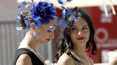 Two Racegoers attend the Dubai World Cup. Martin Dokoupil / Reuters