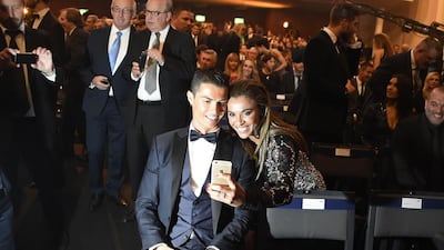 Real Madrid and Portugal forward Cristiano Ronaldo poses for a selfie with Brazilian forward Marta during the Ballon d'Or ceremony on Monday night in Zurich. Olivier Morin / AFP