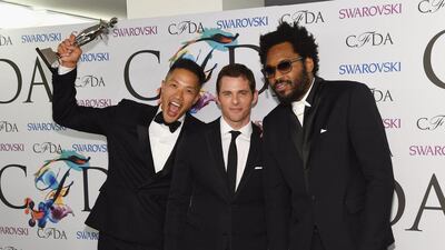 Menswear designer of the year award recipients designers Dao-Yi Chow and Maxwell Osborne of Public School pose with actor James Marsden at the 2014 CFDA fashion awards. Larry Busacca/Getty Images/AFP