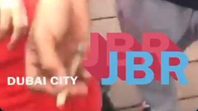 A screengrab from a video posted to social media showing three men pretending to smoke hashish at Jumeirah Beach Residence in Dubai.