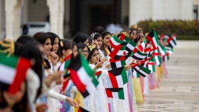 Schoolchildren wait to welcome Sheikh Meshal at Qasr Al Watan. Ryan Carter / UAE Presidential Court