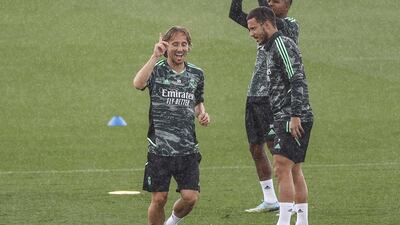 Real midfielder Luka Modric celebrates during training. EPA