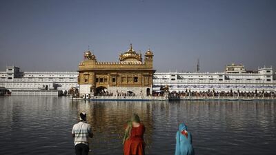 Sikhs attend the shrine on the anniversary of the massacre. Altaf Qadri / AP Photo