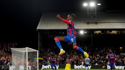 Wilfried Zaha celebrates scoring the opening goal. PA