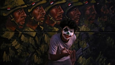 A demonstrator poses for photos during ongoing anti-government protests, in Baghdad. Reuters