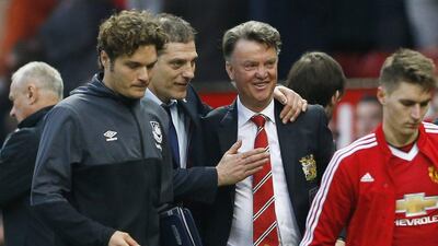 Manchester United manager Louis van Gaal and West Ham manager Slaven Bilic walk off after the game. Action Images via Reuters / Carl Recine