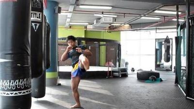 Maintain fighting position, with the right hand guarding your chin. Jeffrey Biteng / The National