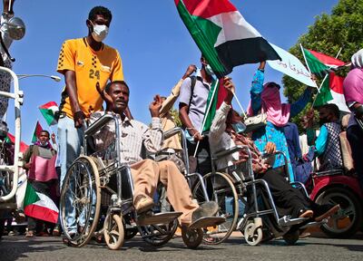 Sudanese demonstrators march in Khartoum on December 9, 2021, to protest against deal that reinstated Prime Minister Abdulla Hamdok after a military coup. AFP