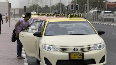 A woman takes a taxi from the RTA’s rank at Ibn Battuta. Jaime Puebla / The National