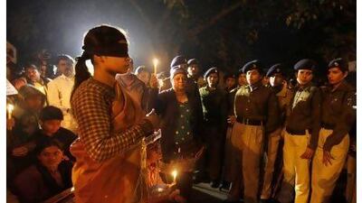 Numerous anti-rape protests, including this one in New Delhi on Sunday, do not change the fact that enduring social factors make life difficult, and dangerous, for India's women, a reader says. Altaf Qadri / AP