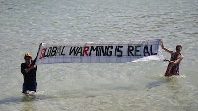 Extinction Rebellion protesters in the sea on the sidelines of the final day of the G7 summit, in St Ives, UK. Bloomberg
