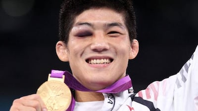 Hyeonwoo Kim of South Korea celebrates with his gold medal in the Men’s Greco-Roman 66 kg Wrestling final. Pic: Orestis Panagiotou/EPA