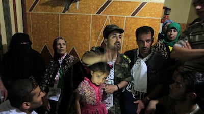Freed Palestinian prisoner Salah al-Sahair (C), who was held by Israel for 21 years, arrives at his family's house in Khan Younis. AFP PHOTO / SAID KHATIB