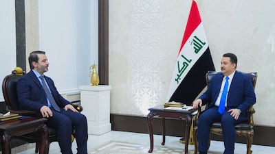 Syria's Foreign Minister Asaad Al Shibani, left, meets Iraqi Prime Minister Mohammed Shia Al Sudani in Baghdad. AFP