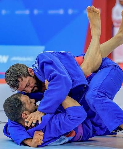 Sultan Al Neyadi, Minister of State for Youth Affairs, grapples for supremacy on the mat. Photo: Open Masters Games