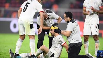 Egypt's defender Mahmoud 'El Wensh' Hamdy receives treatement on a head injury. AFP