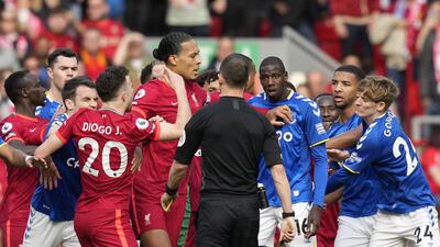 Everton's Abdoulaye Doucoure argues with referee Stuart Attwell. EPA