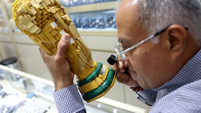Dubai-based jeweller Hemant Karamchandani with the custom-made Lego World Cup. Chris Whiteoak / The National