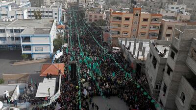 Palestinians take part in a rally marking the 32nd anniversary of Hamas founding, in the northern Gaza Strip. Reuters