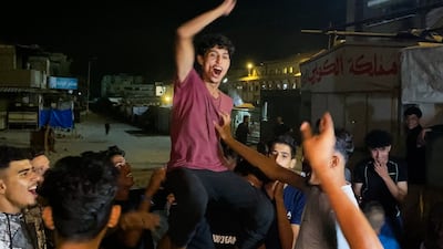 Palestinians celebrate in Khan Younis after US President Donald Trump announced that Israel and Hamas had agreed the first phase of a peace deal in Gaza. AFP