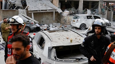Rescuers work near a damaged building following an Iranian strike in the Israeli city of Bnei Brak, east of Tel Aviv. AFP