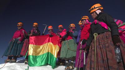 From left, Juana Rufina Llusco, Senobia Llusco, Camila Tarqui Llusco, Cecilia Llusco, Adela Llusco, Erica Tinkuta, Janet Mamani and Gabriela after reaching the summit.