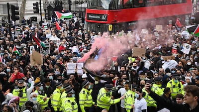 Supporters of Palestine attend a rally outside the UK prime minister's residence at 10 Downing Street, London, in protest at violence in Jerusalem and Israeli air strikes on the Gaza Strip. EPA