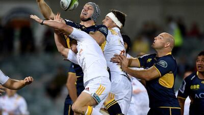 Waikato Chiefs players tackle David Pocock of the Brumbies during their Super Rugby match on Saturday. Lukas Coch / EPA / April 2, 2016