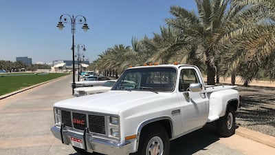 A GMC Sierra Classic 1500 truck heads a line of classic cars on display at the show. Adam Workman / The National