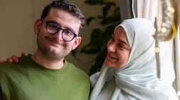 Mahmoud Hijazi with his mother Faten Merachly, who says properly explaining the Iran war and missile attacks to people with special needs helps counter their anxiety. Chris Whiteoak / The National