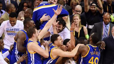 Stephen Curry #30 and the Golden State Warriors celebrate their 105 to 97 win over the Cleveland Cavaliers in Game Six of the 2015 NBA Finals at Quicken Loans Arena on June 16, 2015 in Cleveland, Ohio. NOTE TO USER: User expressly acknowledges and agrees that, by downloading and or using this photograph, user is consenting to the terms and conditions of Getty Images License Agreement. Jason Miller/Getty Images