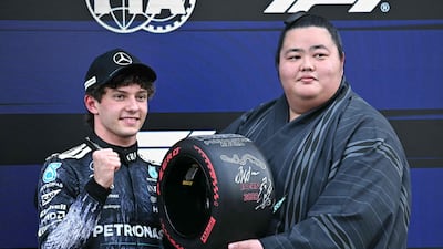 Kimi Antonelli with Japanese sumo wrestler Kotozakura Masakatsu II after sealing pole position at the Japanese Grand Prix. AFP