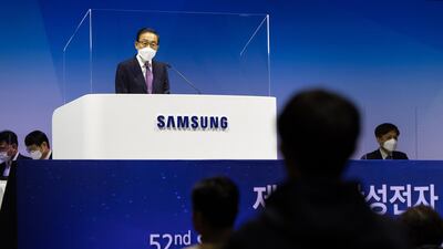 Kim Ki-nam, co-vice chairman and co-chief executive officer of Samsung Electronics Co., speaks from behind a transparent screen during the company's annual general meeting at the Suwon Convention Center in Suwon, South Korea. Huawei Technologies Co. will begin charging mobile giants like Samsung a "reasonable" fee for access to its trove of wireless 5G patents, potentially creating a lucrative revenue source by showcasing its global lead in next-generation networking. Bloomberg