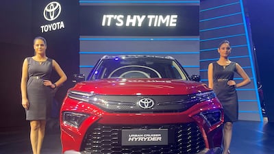 Models pose at the unveiling of Toyota's new hybrid SUV Urban Cruiser Hyryder in New Delhi, India. Reuters