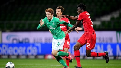 Joshua Sargent, left, of Bremen challenges Edmond Tapsoba of Leverkusen during the German Bundesliga soccer match between Werder Bremen and Bayer Leverkusen 04 in Bremen, Germany. AP Photo
