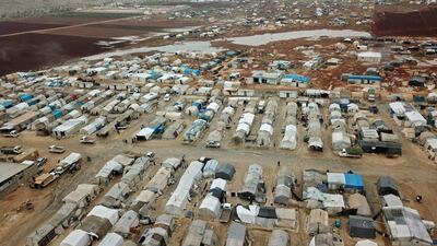 A drone picture takenshows a camp for displaced Syrians near the town of Kafr Lusin by the border with Turkey, in Syria's rebel-held northwestern province of Idlib. AFP