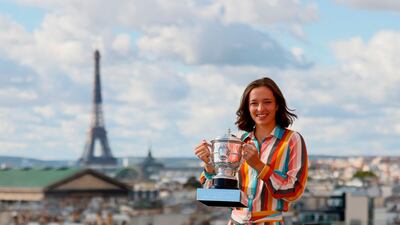 Poland's Iga Swiatek poses with the trophy Suzanne Lenglen. AFP