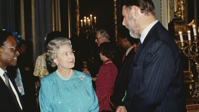Queen Elizabeth II meets Mr Waite at a Commonwealth Day reception in London, in 1992. Getty