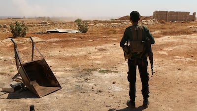 A Syrian rebel fighter rests at an unknown location in the the Idlib province. AFP